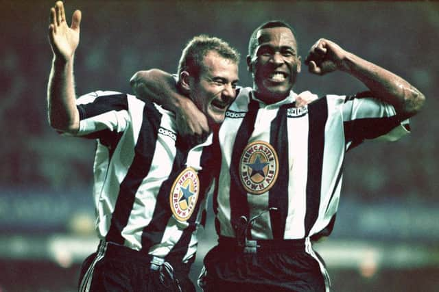 Newcastle strikers Alan Shearer (l) and Les Ferdinand celebrate the fourth goal scored by Shearer during the Premier League match between Newcastle United and Manchester United at St Jame's Park on October 20, 1996 in Newcastle, England, Newcastle won the game 5-0. (Photo by Ben Radford/Allsport/Getty Images/Hulton Archive)