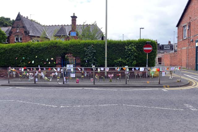 Pupils and parents have been leaving tributes at the school crossing.