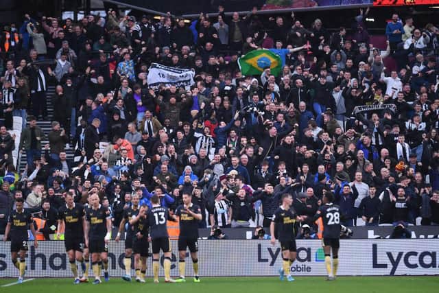 Newcastle United fans celebrate their team's first goal during the Premier League match between West Ham United and Newcastle United at London Stadium on February 19, 2022 in London, England. (Photo by Alex Burstow/Getty Images)