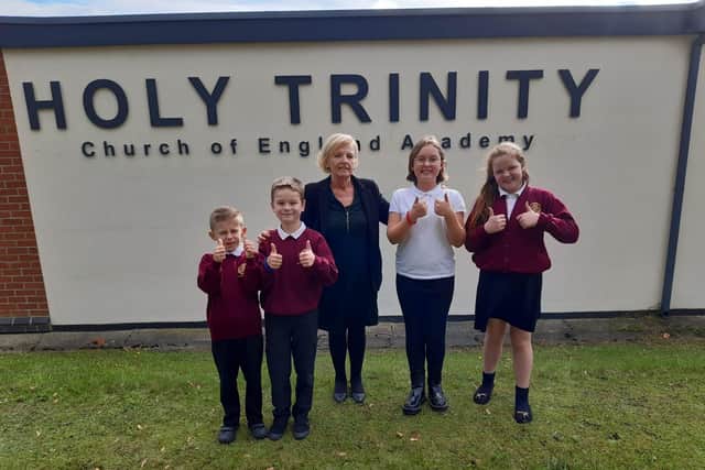 Headteacher Tina Murphy and pupils Harvey Marshall, seven, Vincent Todd, 10, Amelia Atkinson, 10, and Maizie Mcfarlane, 10, give a big thumbs up to the school's good Ofsted judgement.