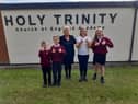 Headteacher Tina Murphy and pupils Harvey Marshall, seven, Vincent Todd, 10, Amelia Atkinson, 10, and Maizie Mcfarlane, 10, give a big thumbs up to the school's good Ofsted judgement.