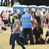 Security removing someone from the crowd at the third South Tyneside Festival 2022 gig at Bents Park.