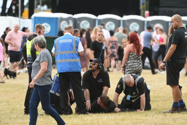 Security removing someone from the crowd at the third South Tyneside Festival 2022 gig at Bents Park.