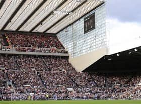 Supporters of both Newcastle United and Bournemouth take part in an applause on the 70th minute as a tribute to Her Majesty Queen Elizabeth II who died at Balmoral Castle on September 8, 2022 (Photo by Stu Forster/Getty Images)