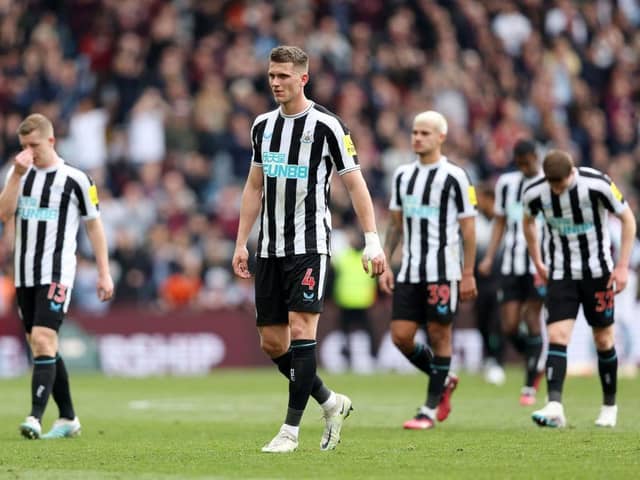 Newcastle United defender Sven Botman, centre, and his team-mates after the final whistle at Villa Park.