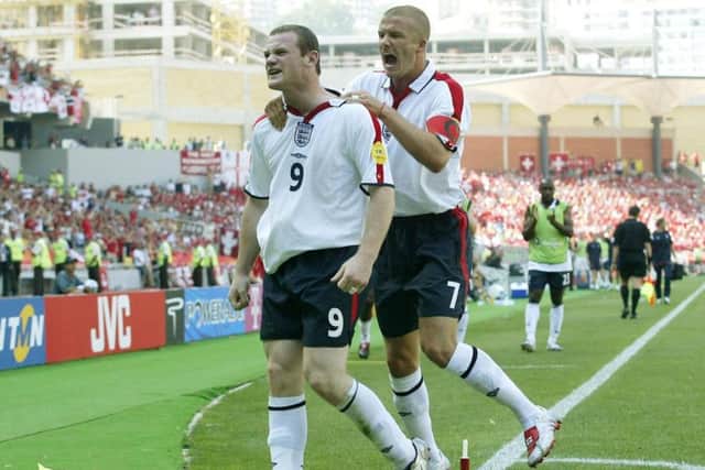 Wayne Rooney celebrates one of his goals against Switzerland at Euro 2004 with David Beckham. Pic: PA.