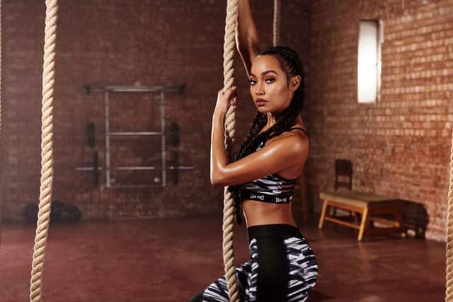 Leigh-Anne Pinnock tries out the clothing line she helped create.