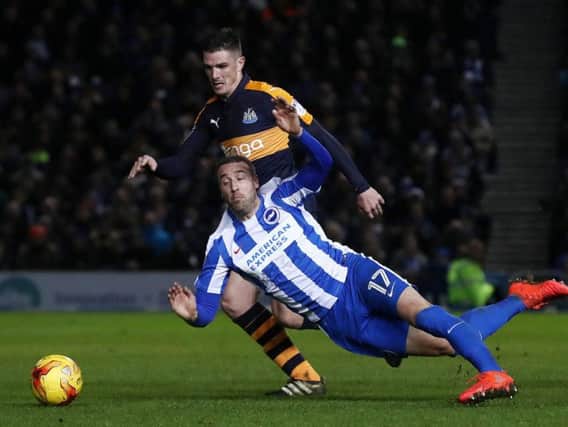 Glenn Murray is bundled over by Ciaran Clark at the Amex Stadium earlier this week.