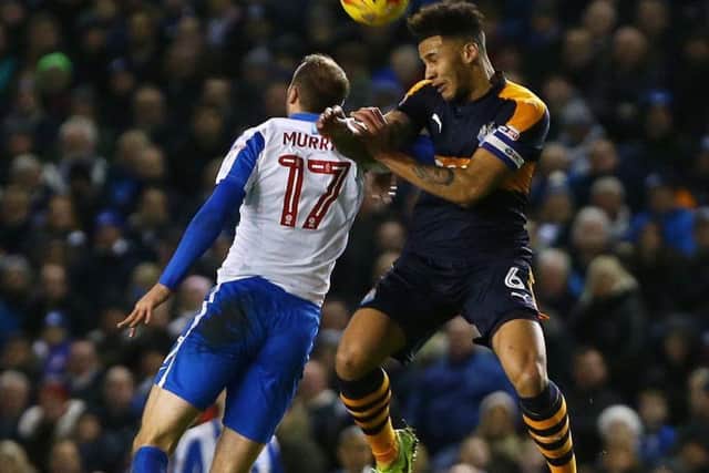 Jamaal Lascelles goes head-to-head with Glenn Murray on Tuesday night.