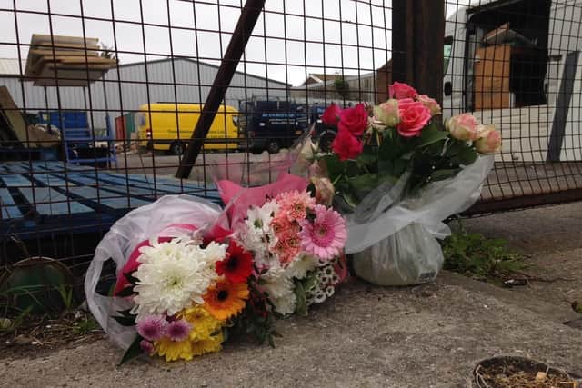 Flowers left at the scene of the accident.
