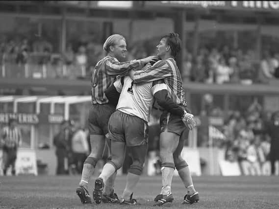 Newcastle players celebrate after keeper John Burridge, centre, saves a late penalty in their 1990 play-off first leg at Sunderland. Victory, however, was far from assured.