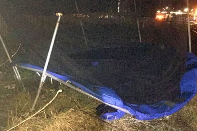 A photo issued by Network Rail of a trampoline which was blown on to the railway in Aylesbury, Buckinghamshire.