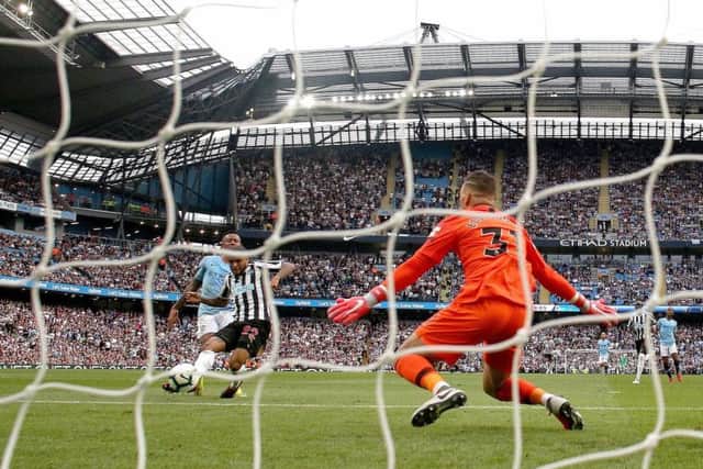 Newcastle United's DeAndre Yedlin scores his side's first goal of the game during the Premier League match at the Etihad Stadium, Manchester.