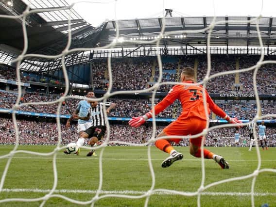 Newcastle United's DeAndre Yedlin scores his side's first goal of the game during the Premier League match at the Etihad Stadium, Manchester.