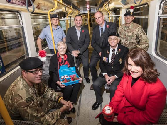 Back row, Cpl Mike Wharrier, RAF, Chris Carson and Huw Lewis, from Nexus, Sgt Bateman of X Company Fifth Fusiliers, with veterans George and Irene Woodall, plusCpl Webster of X Company Fifth Fusiliers and Nicola Meredith from The Royal British Legion.