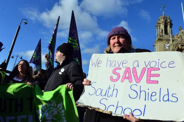 Campaigners demonstrate against the school's potential closure.