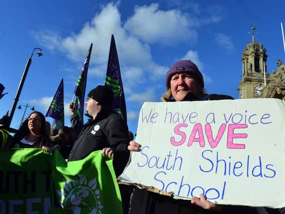 Campaigners demonstrate against the school's potential closure.