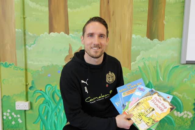 Jon Shaw read four books to the children