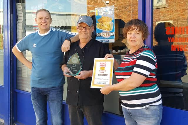 Keith Beat Frankie Dowdall and Stephanie Dowdall with their award at Frankie's Fish and Chips