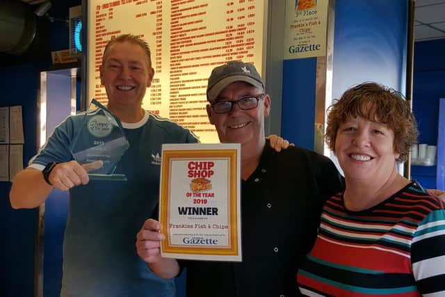 Keith Beat, Frankie Dowdall and Stephanie Dowdall celebrate their award at Frankie's Fish and Chips