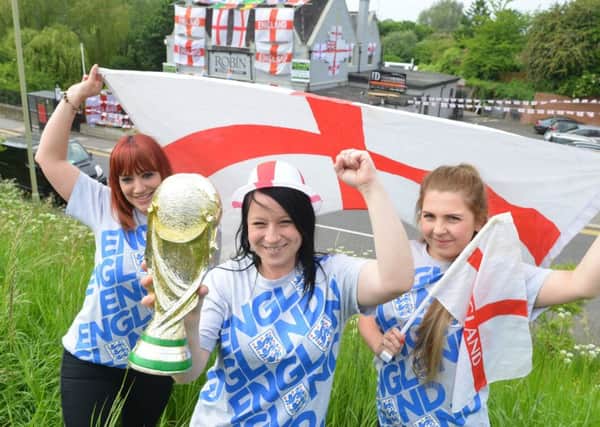 The Robin Hood staff Jennifer Duffy, Clare McFall and Elise Rodham fly the flag
