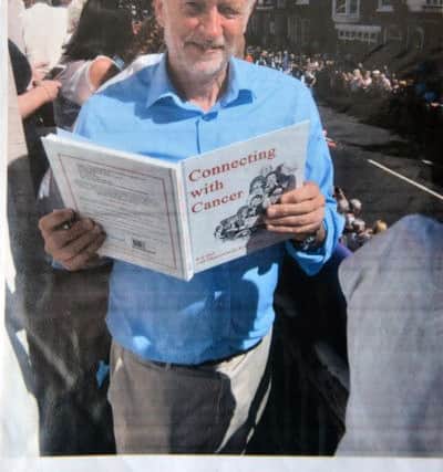 Labour leader Jeremy Corbyn with the book.