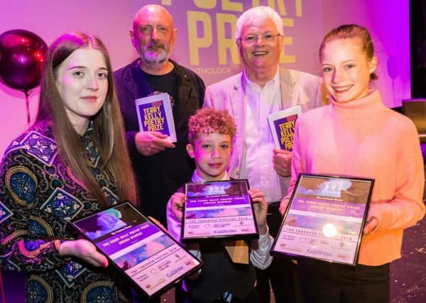 The Terry Kelly Poetry Prize winners, front left to right, Lauren Aspery, Finn Edmonds and Bo Buglas, with judges Alistair Robinson, back left, and Tom Kelly, back right.