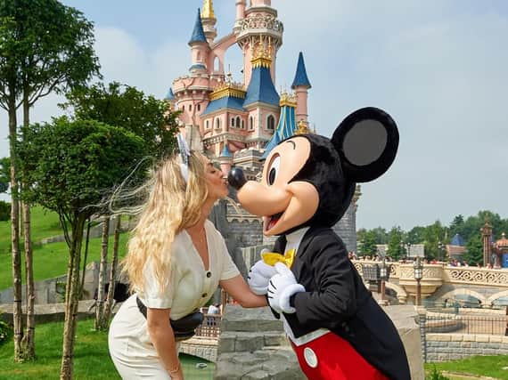 Perrie and Mickey Mouse at Disneyland Paris.