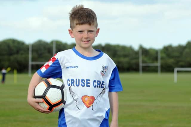 Cruse Crew strip donations to Boldon Colts junior FC. Olly Carson