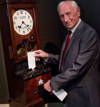 Bob Olley clocks in to the exhibition using the restored Westoe Colliery clock. Photo by Colin Davison