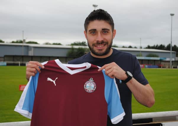 Josh Gillies shows off his new South Shields colours.