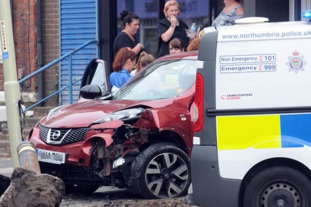 Man taken to hospital after car collides with lamppost and bollard