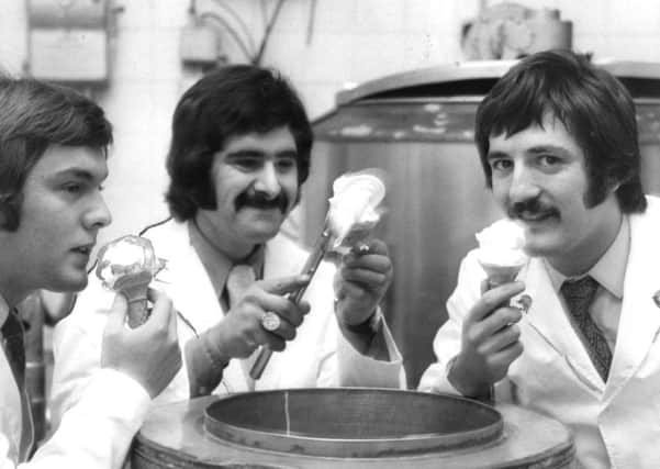 Romano Michella, centre with cousins, Trevor, left and Michael as they sample the ice cream that won them top honours in Paris.
