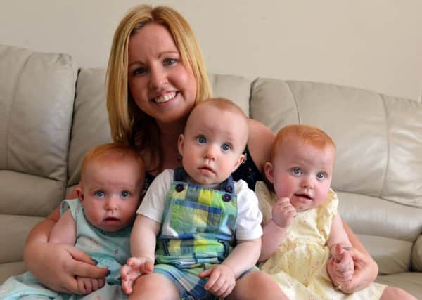 Kane triplets celebrate their first birthday From left Annabelle, Joey and Grace with mother Andrea Kane
