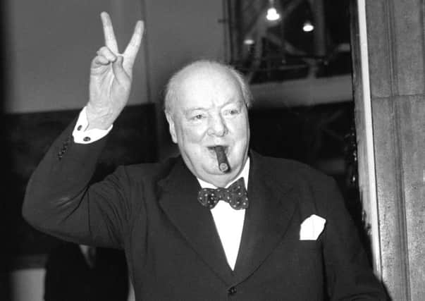 Winston Churchill giving his famous 'V for Victory' sign.
