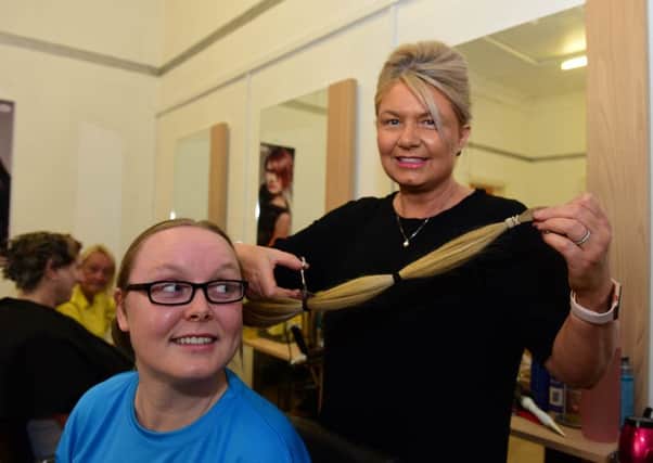 Lindsay Reilly having her hair cut by stylist Gillian Maclean, at Creations, Black Road, Hebburn, on Saturday, in aid of the Little Princess Trust.