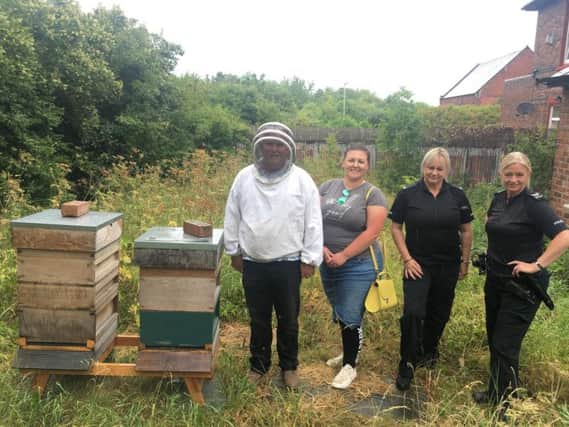 Bee keeper Steve Cattanach and Nina Goudie, who helped lead the fundraising campaign to help replace his damaged hives, pictured with Pc Nicola Bute and Sergeant Claire Fada.