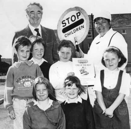 Award-winning lollipop lady Ann Watson with some of her admirers pictured in 1990.