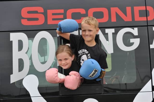 Members of Seconds Out Boxing Academy from Ferryhill, Danya Eddy and Reagan Thompson in the clubs new minibus, helped by the Together Forever Trust.