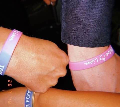 Some of the guests wore Chloe and Liam Together Forever wristbands.