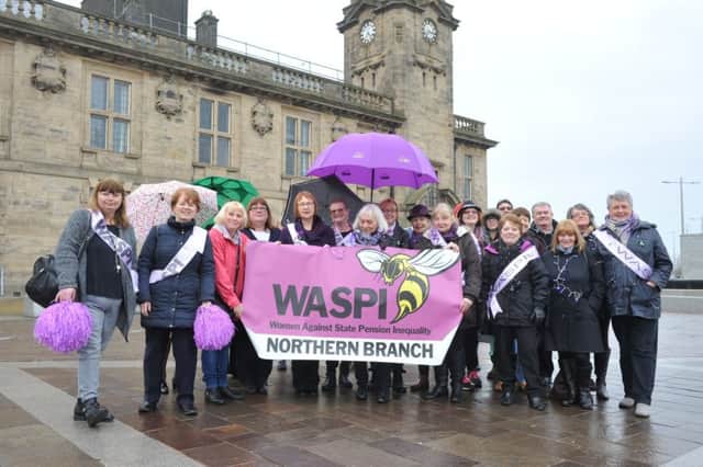 Members of WASPI (Women Against State Pension Inequality) celebrate International Women's Day.