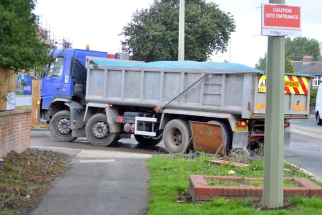 A lorry turning into the site.