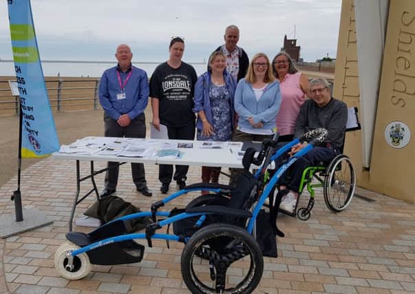 Emma Lewell-Buck Mp, third right,  with her  team at Littlehaven and one of the wheelchairs