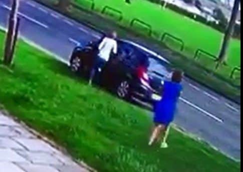 A woman ran out of a neighbouring house and appeared to film the couple who stolen plant pots in a car bearing stolen number plates.