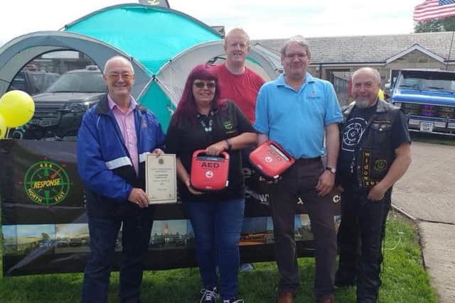 The 4x4 team are presented with defibrillators following a Freemason donation