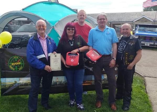 The 4x4 team are presented with defibrillators following a Freemason donation
