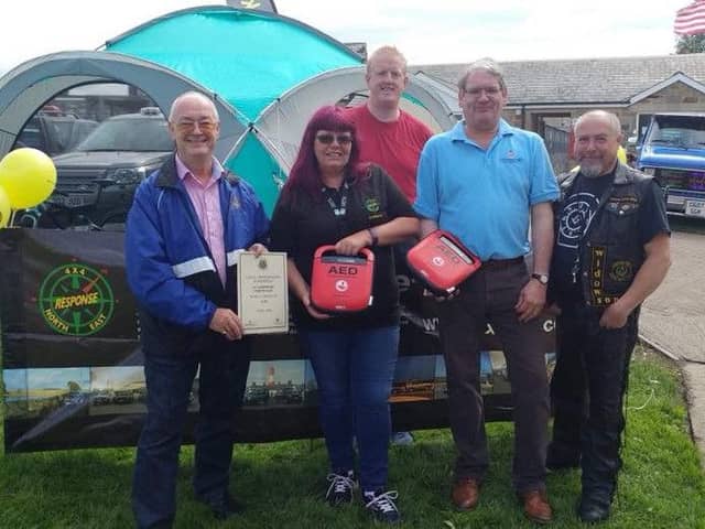 The 4x4 team are presented with defibrillators following a Freemason donation