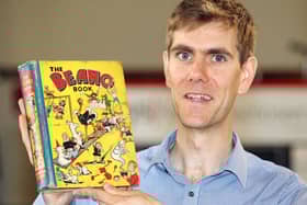 Robert Henshilwood, head of books at Keys auctioneers, holding the first ever Beano Annual, which is expected to sell for between Â£1,200 and Â£1,500. Pic: Andy Newman/PA Wire.