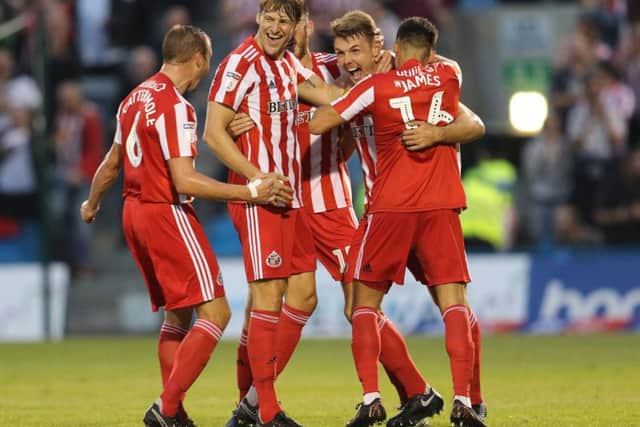 Sunderland players celebrate a goal in the 4-1 win at Gillingham.