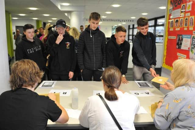 Students at Hebburn Comprehensive School receiving their GCSE results.